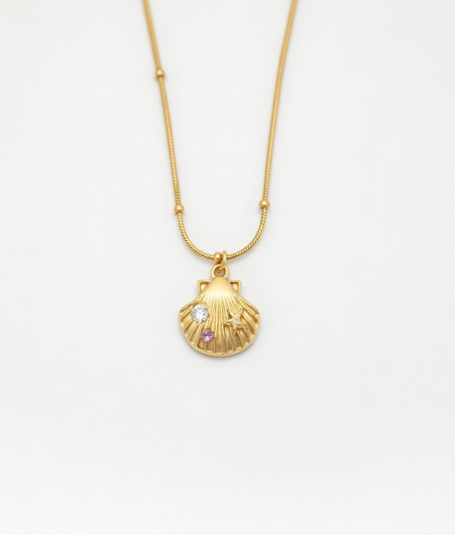 Gold plated seashell pendant necklace with multi-color stones on model by Just Jewel