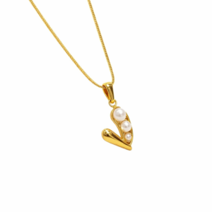 Elegant jewelry photography of a bold black heart pendant on an 18K gold plated snake chain with a white background.