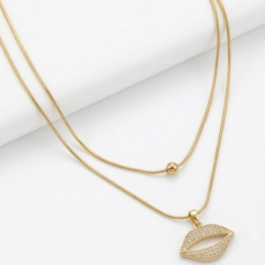 Crystal lips pendant necklace on a gold double-layer snake chain