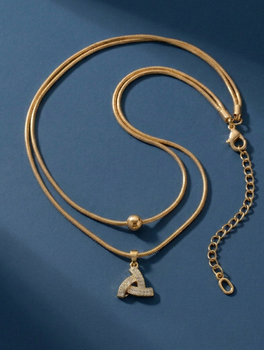 Elegant Dual-Layered Gold-Plated Snake Chain Necklace with Shimmering Interlocked Triangle Diamond Pendant and Minimalist Bead Accent