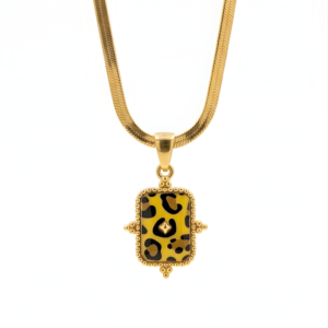 Detailed view of a gold Leopard Print Rectangle Pendant on a Flat Herringbone Chain