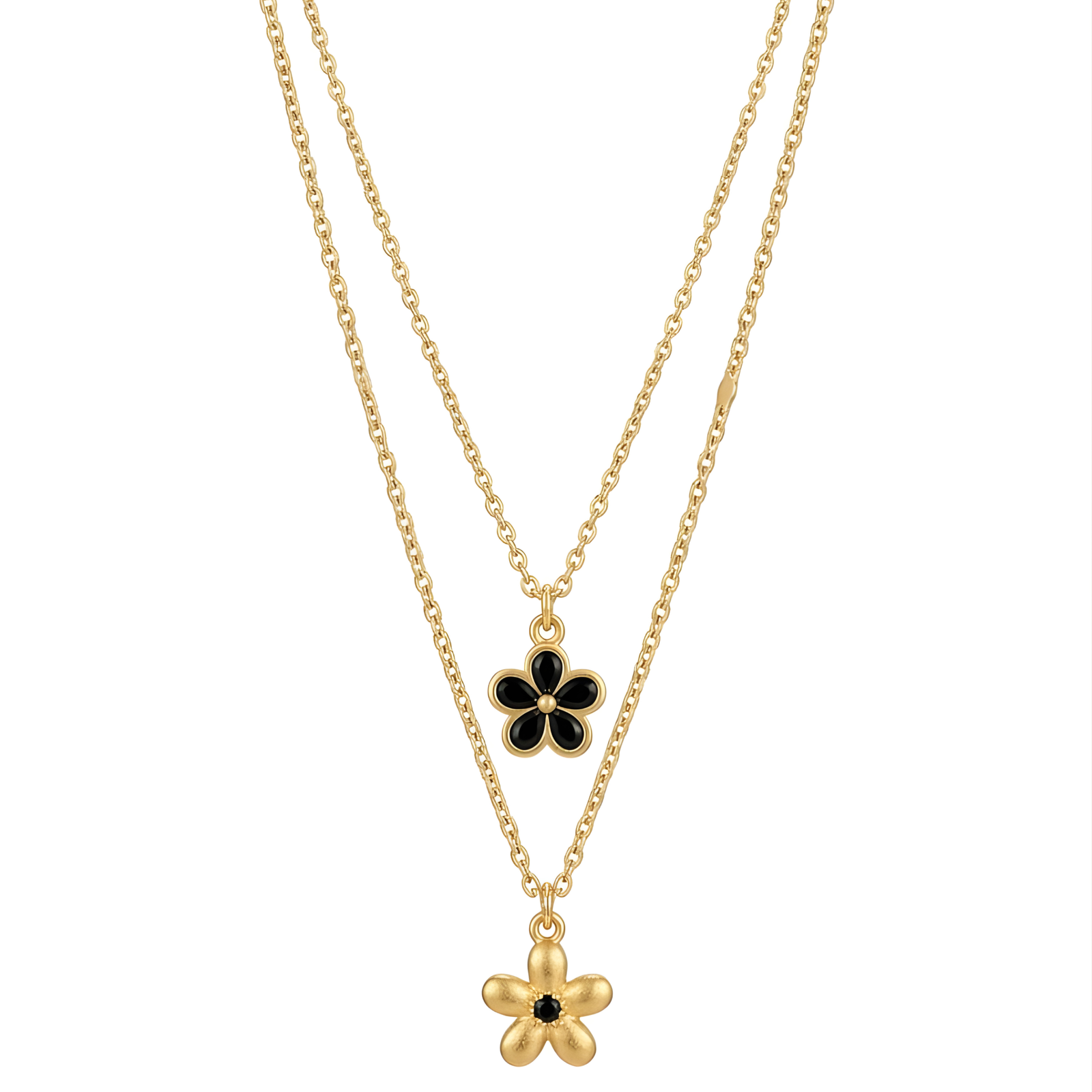 Close-up of a double-layered gold necklace with black enamel and textured gold flower pendants