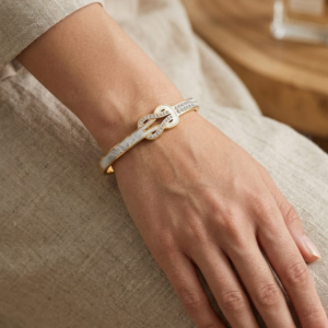 Gold Plated Infinity Buckle Mother of Pearl Bangle from justjewel.co.in, waterproof and anti-tarnish luxury jewelry.